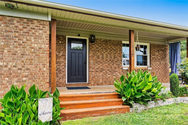 381 Mountain View St, Forest City, NC 28043 - doorway to property with brick siding and a porch