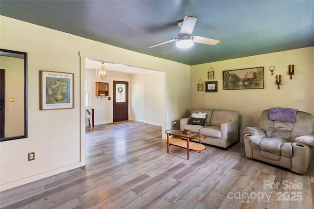 381 Mountain View St, Forest City, NC 28043 - living area with wood finished floors, baseboards, and a ceiling fan