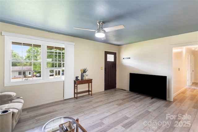 381 Mountain View St, Forest City, NC 28043 - foyer entrance featuring light wood-type flooring, ceiling fan, and baseboards