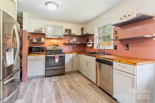 381 Mountain View St, Forest City, NC 28043 - kitchen featuring open shelves, stainless steel appliances, wooden counters, light wood finished floors, and a sink