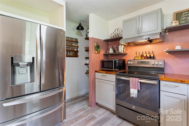 381 Mountain View St, Forest City, NC 28043 - kitchen featuring appliances with stainless steel finishes, open shelves, under cabinet range hood, and wood counters