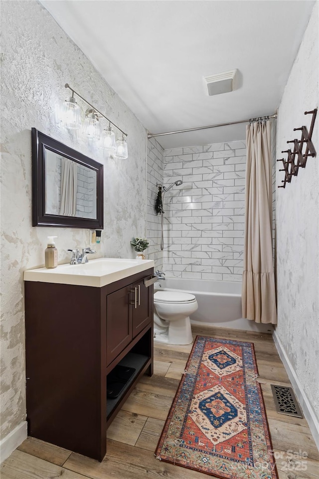381 Mountain View St, Forest City, NC 28043 - full bath featuring vanity, shower / bath combination with curtain, wood finished floors, and toilet