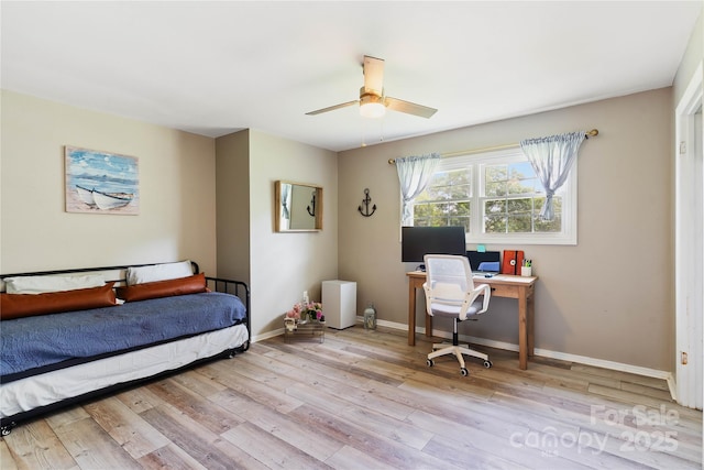 381 Mountain View St, Forest City, NC 28043 - bedroom with wood finished floors, baseboards, a desk, and ceiling fan