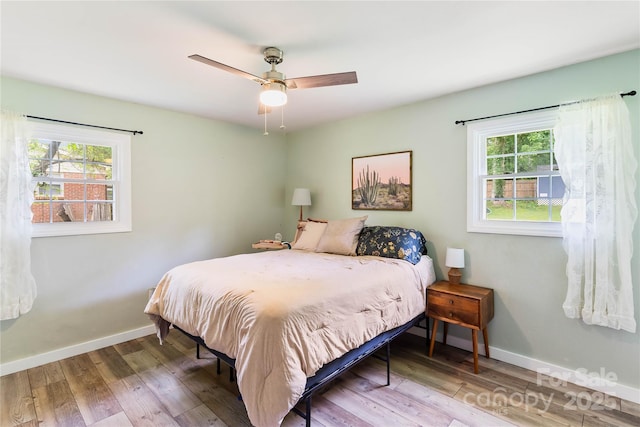 381 Mountain View St, Forest City, NC 28043 - bedroom with wood finished floors, baseboards, and a ceiling fan