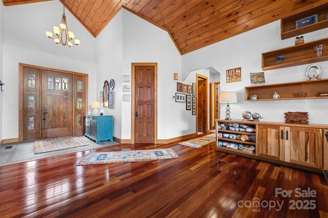2160 Valle Cay Dr, Vilas, NC 28692 - entryway with a chandelier, hardwood / wood-style flooring, baseboards, high vaulted ceiling, and wood ceiling