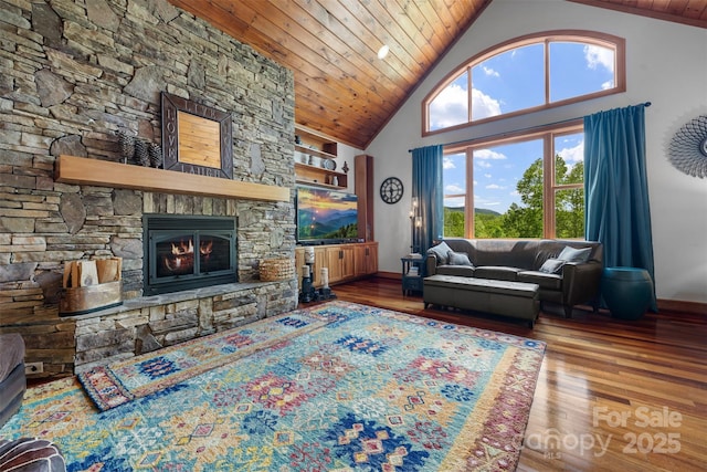 2160 Valle Cay Dr, Vilas, NC 28692 - living room with wood ceiling, wood finished floors, high vaulted ceiling, a stone fireplace, and baseboards