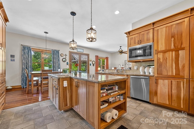 2160 Valle Cay Dr, Vilas, NC 28692 - kitchen featuring built in microwave, dishwasher, stone tile floors, open shelves, and recessed lighting