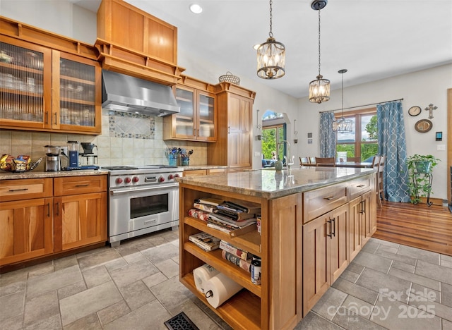2160 Valle Cay Dr, Vilas, NC 28692 - kitchen with luxury stove, wall chimney range hood, open shelves, a chandelier, and backsplash
