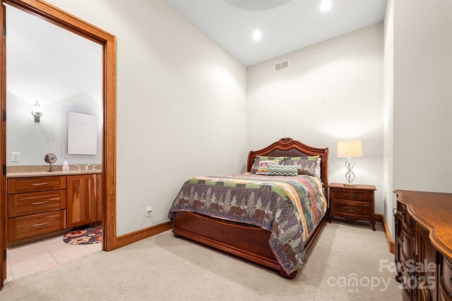 2160 Valle Cay Dr, Vilas, NC 28692 - bedroom with light carpet, ensuite bath, lofted ceiling, recessed lighting, and baseboards