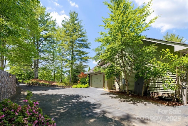 2160 Valle Cay Dr, Vilas, NC 28692 - view of side of home featuring concrete driveway and an attached garage