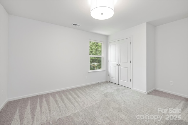 2313 Stallings Rd, Harrisburg, NC 28075 - unfurnished bedroom with carpet flooring and baseboards