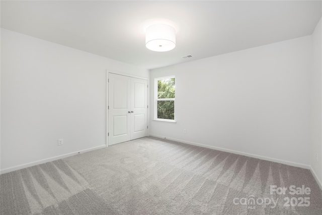 2313 Stallings Rd, Harrisburg, NC 28075 - carpeted spare room with baseboards