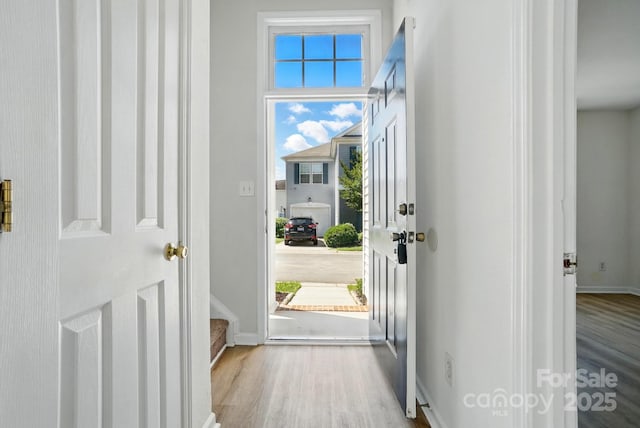 8605 Sawleaf Ct, Charlotte, NC 28215 - doorway featuring wood finished floors and baseboards
