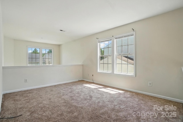 8605 Sawleaf Ct, Charlotte, NC 28215 - carpeted spare room featuring baseboards
