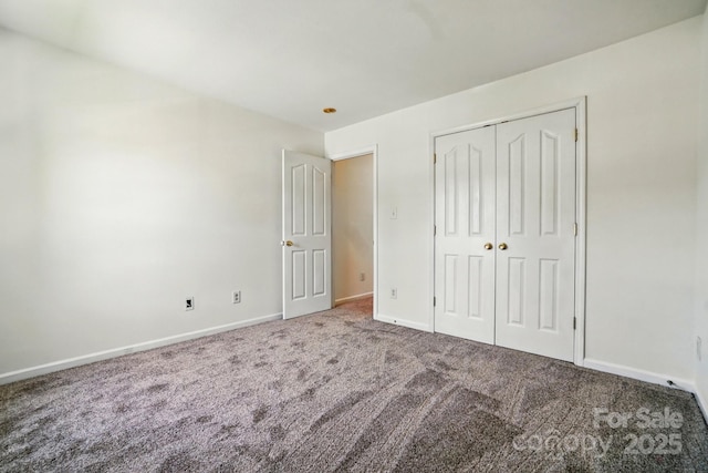 8605 Sawleaf Ct, Charlotte, NC 28215 - unfurnished bedroom featuring carpet flooring, baseboards, and a closet