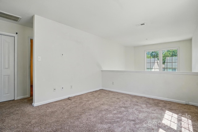 8605 Sawleaf Ct, Charlotte, NC 28215 - spare room featuring carpet flooring and baseboards