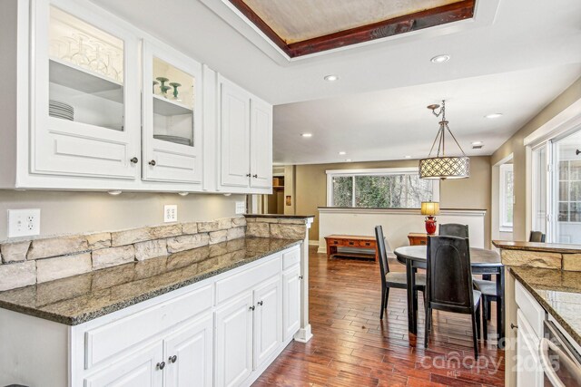 231 Highlands Loop, Maggie Valley, NC 28751 - kitchen featuring dark wood-type flooring, white cabinetry, dishwashing machine, recessed lighting, and dark stone counters