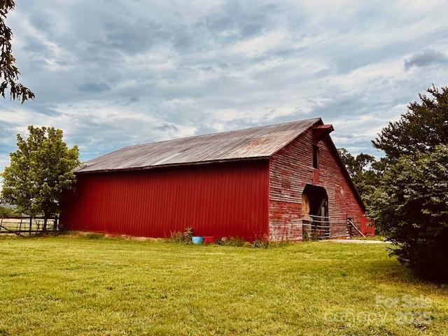 6714 Old Shelby Rd, Vale, NC 28168 - view of home's exterior with a yard, an outbuilding, and a barn