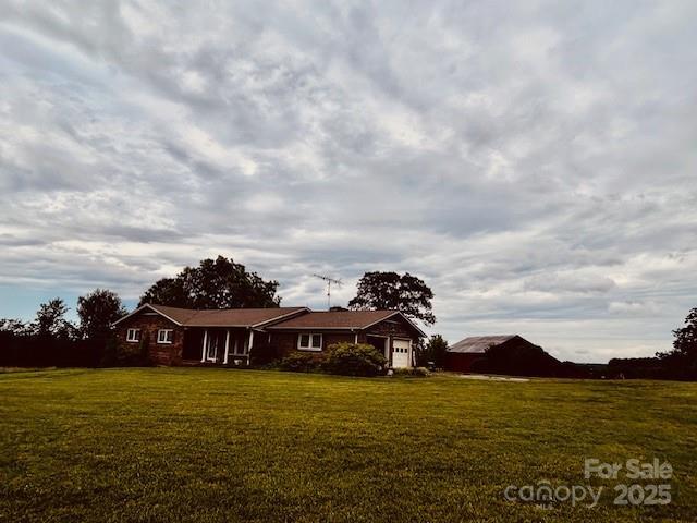 6714 Old Shelby Rd, Vale, NC 28168 - view of front of home with a front yard and a garage