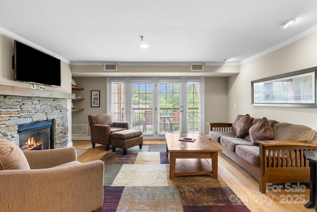 408 Bowling Park Rd, Asheville, NC 28803 - living area with wood finished floors, a fireplace, and crown molding