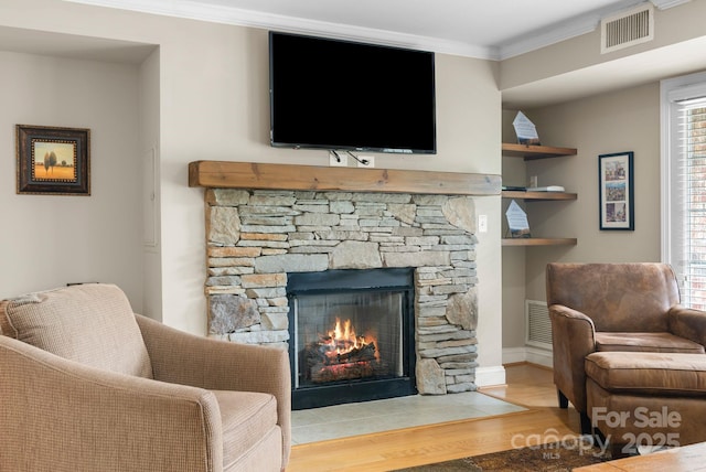 408 Bowling Park Rd, Asheville, NC 28803 - living area with wood finished floors, a fireplace, ornamental molding, and baseboards