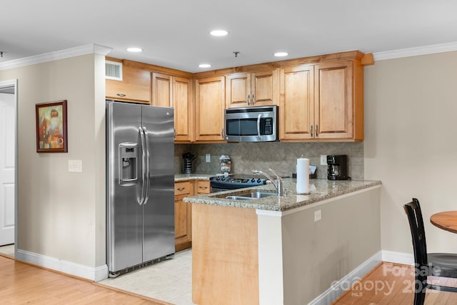 408 Bowling Park Rd, Asheville, NC 28803 - kitchen with stainless steel appliances, a sink, crown molding, baseboards, and backsplash