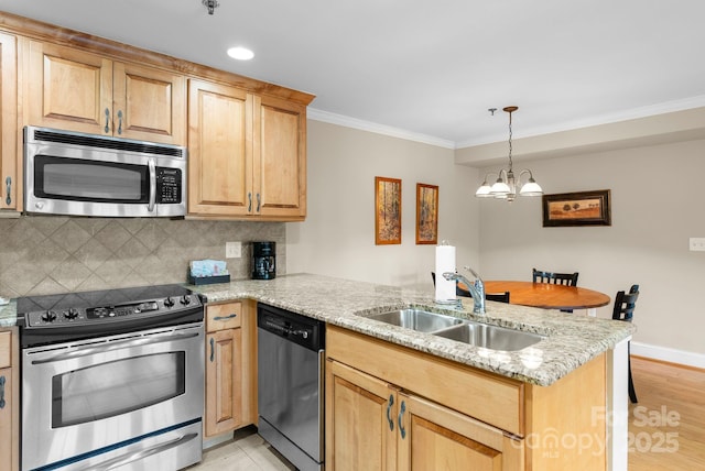 408 Bowling Park Rd, Asheville, NC 28803 - kitchen with stainless steel appliances, a sink, a peninsula, crown molding, and a chandelier