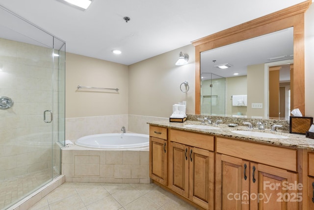 408 Bowling Park Rd, Asheville, NC 28803 - full bathroom with tile patterned flooring, a garden tub, a shower stall, double vanity, and recessed lighting