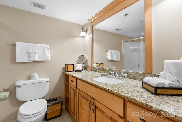 408 Bowling Park Rd, Asheville, NC 28803 - full bathroom featuring vanity, a stall shower, toilet, and tile patterned flooring