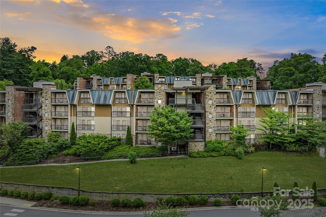 408 Bowling Park Rd, Asheville, NC 28803 - property at dusk with a view of apartment building / complex