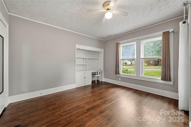 725 W Graham St, Shelby, NC 28150 - unfurnished bedroom with dark wood finished floors, a textured ceiling, baseboards, crown molding, and a ceiling fan