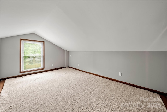 725 W Graham St, Shelby, NC 28150 - additional living space with vaulted ceiling, baseboards, and carpet