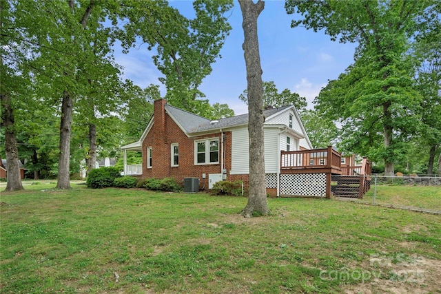 725 W Graham St, Shelby, NC 28150 - view of home's exterior featuring central air condition unit, a deck, a chimney, and brick siding