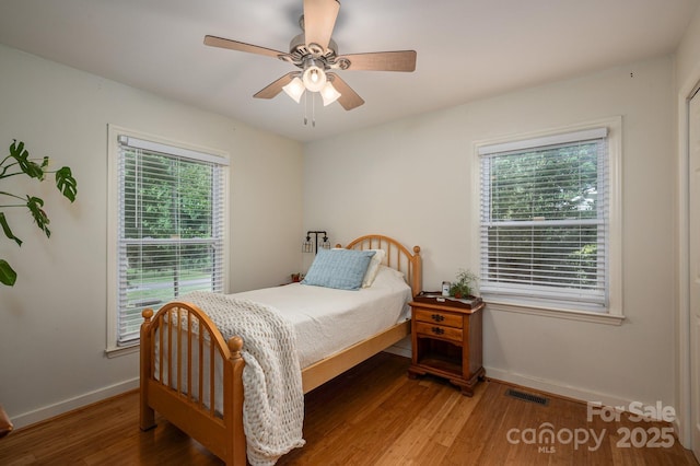 2418 Live Oak Ct, Gastonia, NC 28056 - bedroom featuring baseboards, wood finished floors, and a ceiling fan