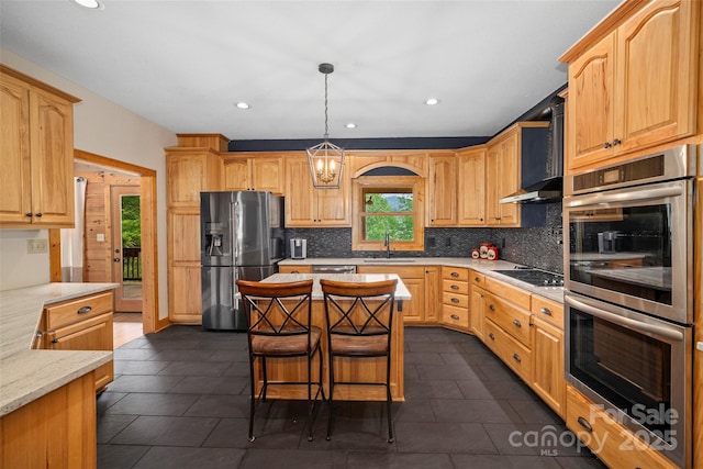 101 Trinity Dr, Clyde, NC 28721 - kitchen featuring stainless steel appliances, tasteful backsplash, a sink, recessed lighting, and a center island