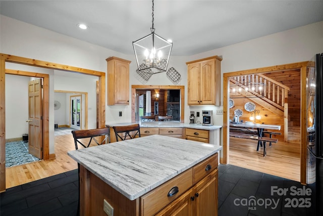 101 Trinity Dr, Clyde, NC 28721 - kitchen featuring a chandelier, a center island, pendant lighting, dark tile patterned floors, and recessed lighting