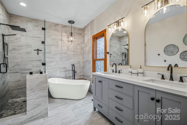 101 Trinity Dr, Clyde, NC 28721 - full bath with a stall shower, double vanity, a soaking tub, and marble finish flooring