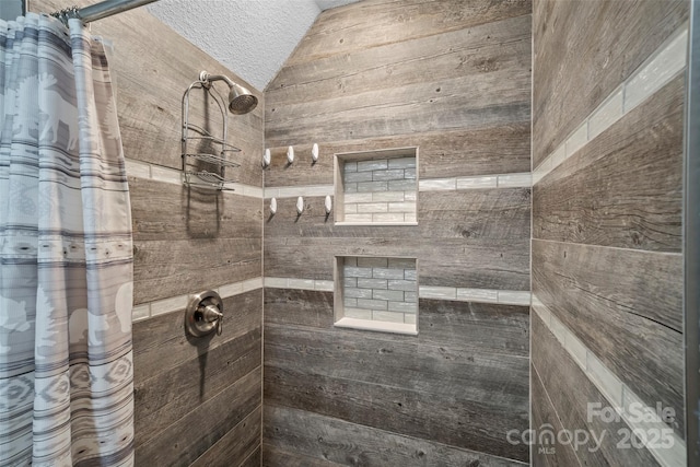 101 Trinity Dr, Clyde, NC 28721 - bathroom with tiled shower and lofted ceiling