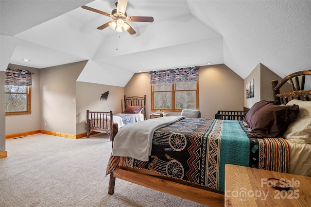 101 Trinity Dr, Clyde, NC 28721 - carpeted bedroom featuring lofted ceiling, baseboards, and a ceiling fan