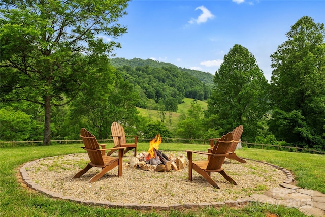 101 Trinity Dr, Clyde, NC 28721 - view of playground with a fire pit, a view of trees, and a yard