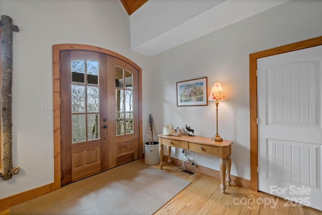 140 Spruce Hollow Rd, Beech Mountain, NC 28604 - entrance foyer featuring french doors, wood finished floors, and baseboards
