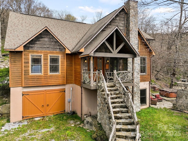 140 Spruce Hollow Rd, Beech Mountain, NC 28604 - chalet / cabin featuring stairs, a shingled roof, and a chimney