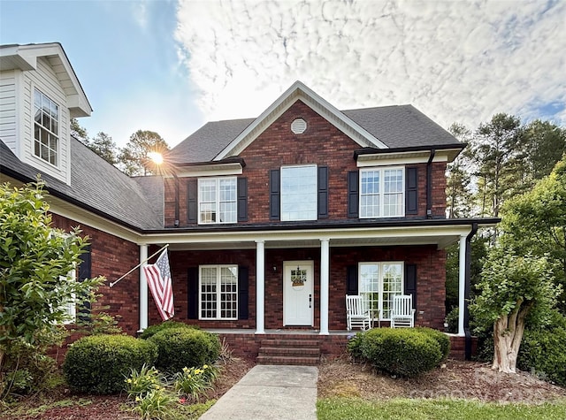 4230 Berry Hill Ct, Concord, NC 28025 - view of front of house with covered porch, brick siding, and roof with shingles