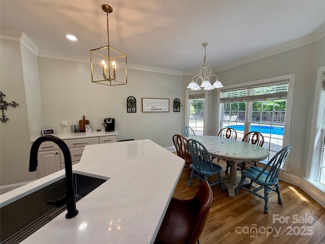 4230 Berry Hill Ct, Concord, NC 28025 - dining room featuring a chandelier, crown molding, wood finished floors, and recessed lighting