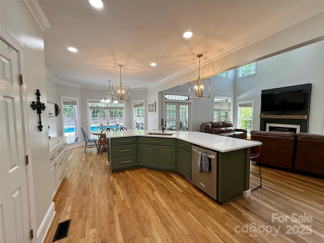 4230 Berry Hill Ct, Concord, NC 28025 - kitchen featuring dishwasher, a chandelier, light countertops, light wood-style floors, and ornamental molding