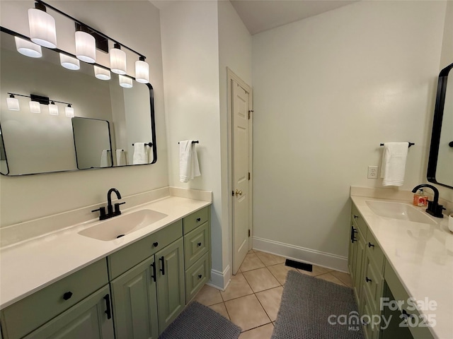 4230 Berry Hill Ct, Concord, NC 28025 - bathroom featuring two vanities and tile patterned floors