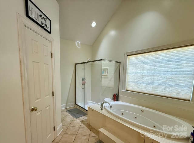 4230 Berry Hill Ct, Concord, NC 28025 - bathroom with lofted ceiling, a shower stall, a jetted tub, and tile patterned floors