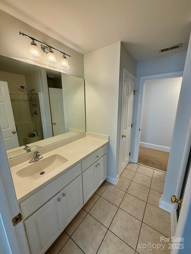 4230 Berry Hill Ct, Concord, NC 28025 - bathroom with vanity, a shower, and tile patterned flooring