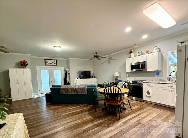 4230 Berry Hill Ct, Concord, NC 28025 - dining area featuring ceiling fan, crown molding, wood finished floors, french doors, and recessed lighting