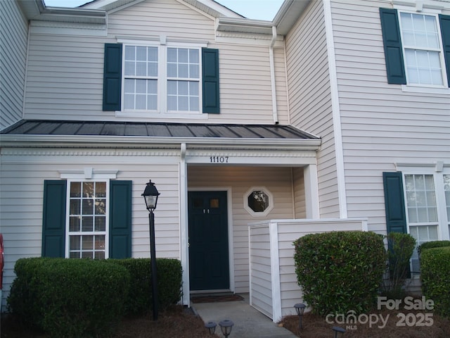 11107 Lions Mane St, Charlotte, NC 28273 - doorway to property with a standing seam roof and metal roof